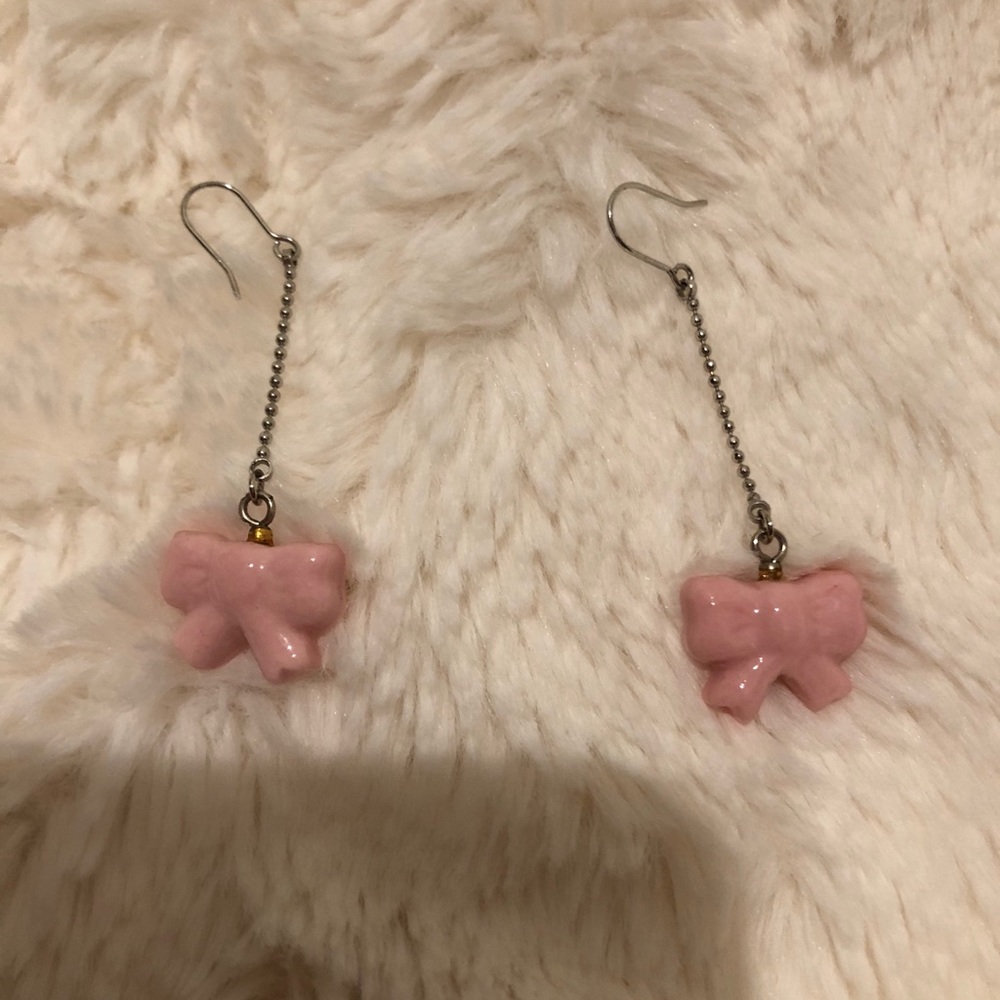 Pink bow dangling earrings